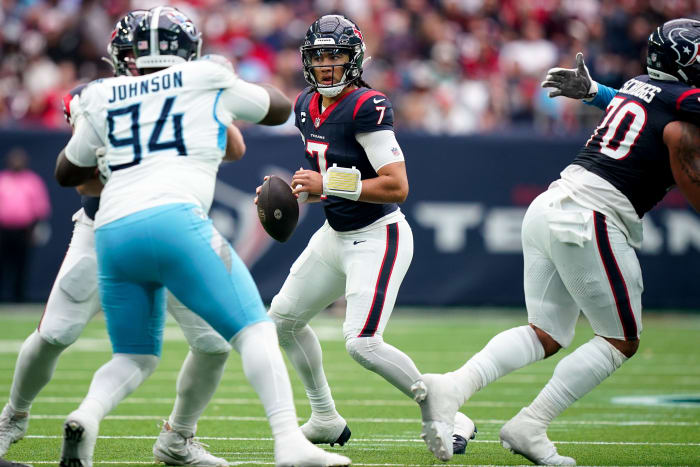 C.J. Stroud (7) looks for a receiver against the Tennessee Titans during the second quarter at NRG Stadium in Houston, Texas.